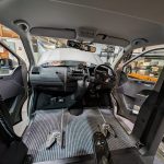 Interior view of a vehicle showing the driver and passenger seats